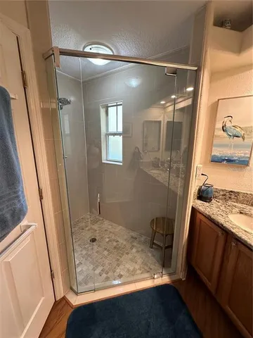 a bathroom with a tub and a sink