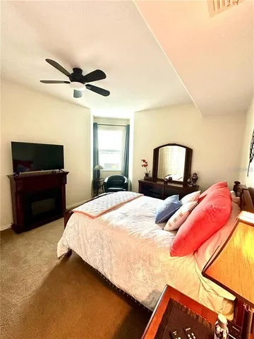 a bedroom with a bed and dresser