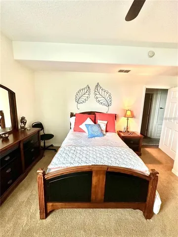 a bedroom with a bed and dresser