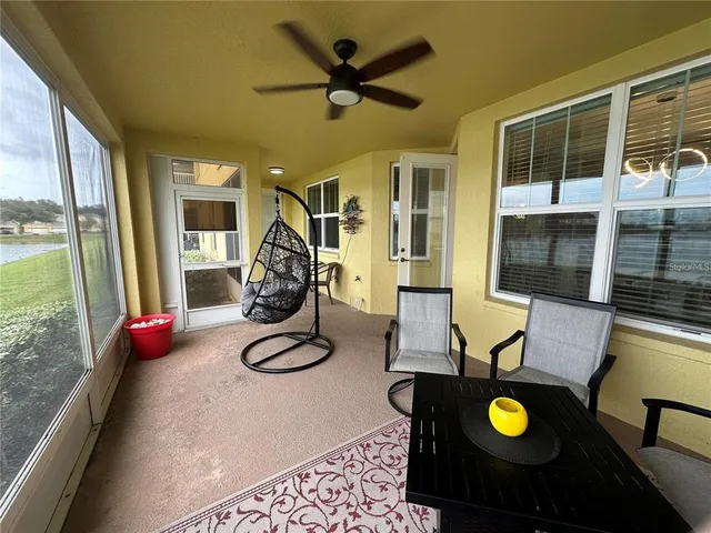a view of a livingroom with furniture and windows