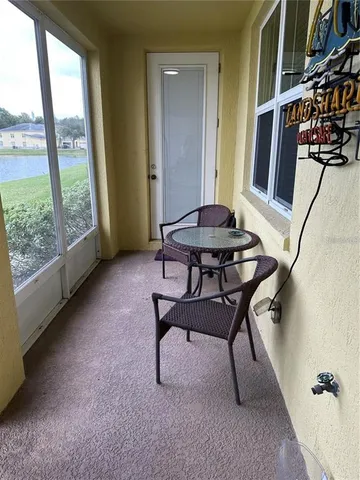a view of a livingroom with furniture and front door