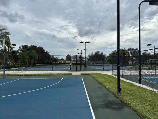 a view of a swimming pool with a lawn chairs