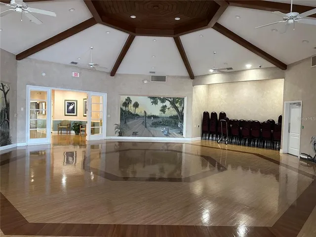 a view of a living room and chandelier