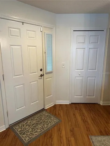 an empty room with wooden floor