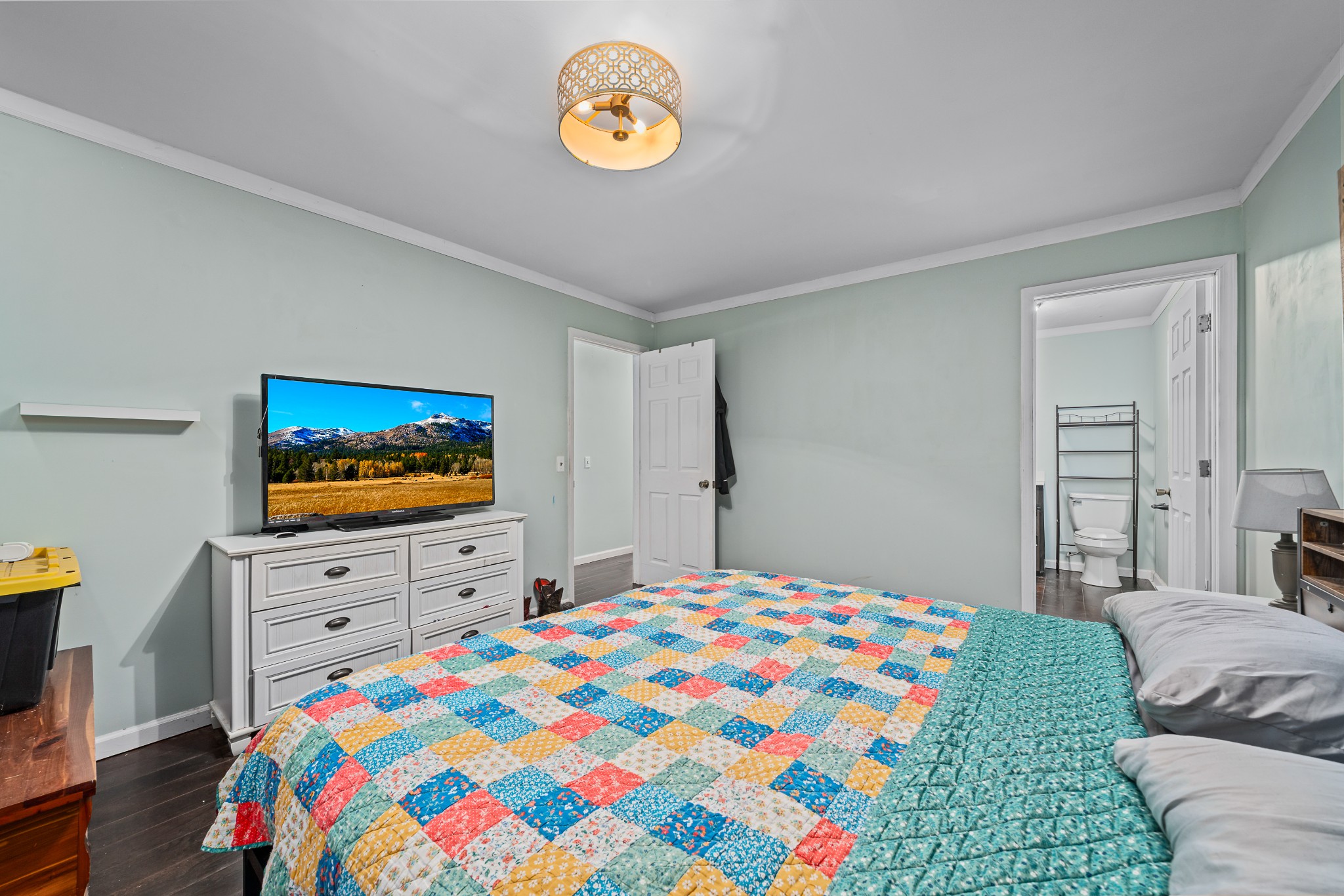 4871 New Window Cliff Road Baxter, TN 38544 - Photo 12 of 26 a bedroom with a bed a flat screen tv and a window