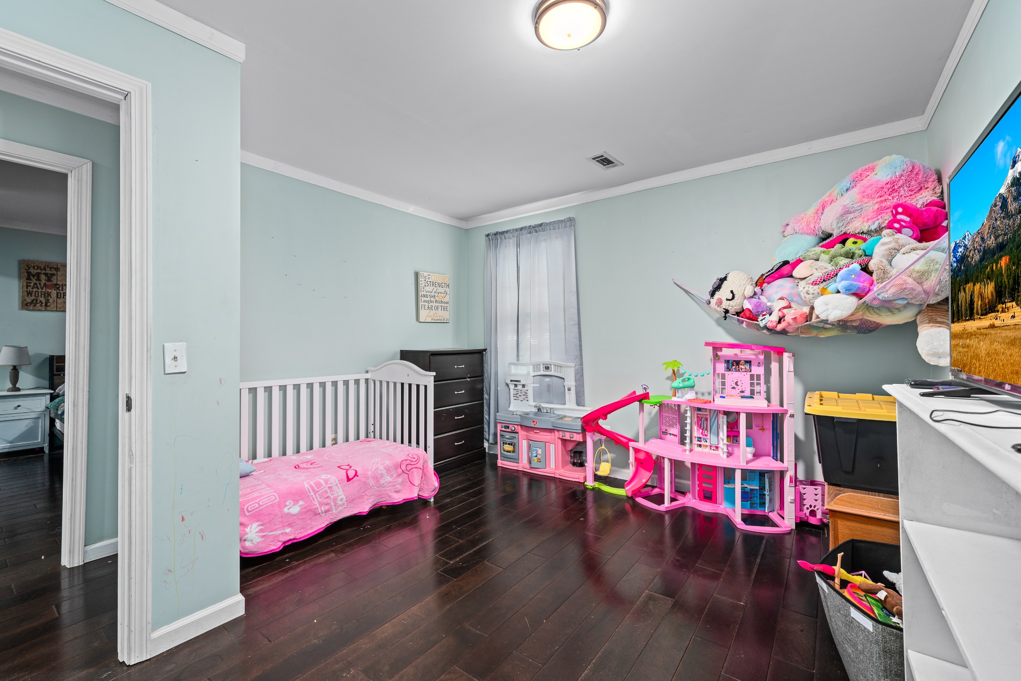 4871 New Window Cliff Road Baxter, TN 38544 - Photo 16 of 26 a bedroom with furniture and a wooden floor