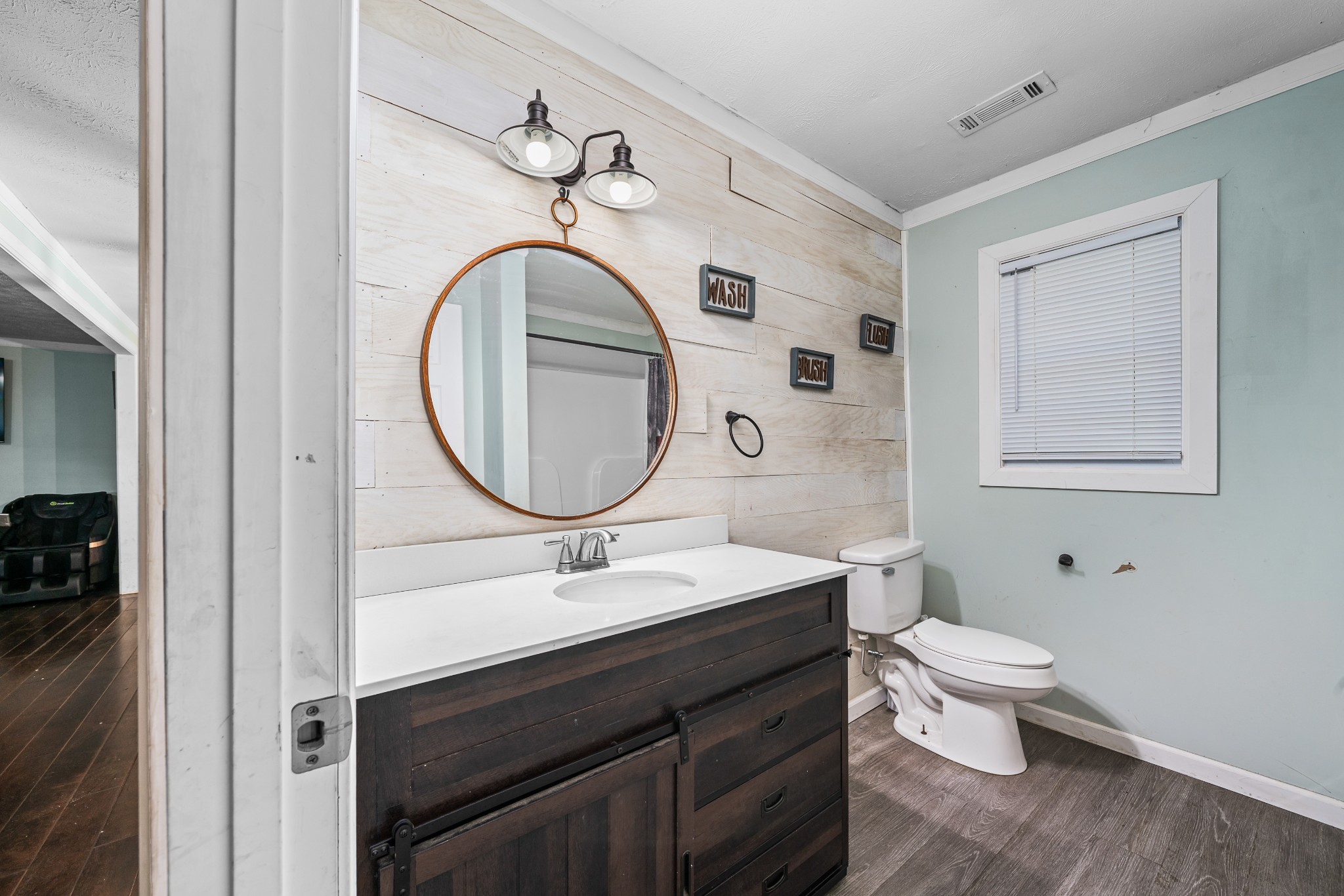 4871 New Window Cliff Road Baxter, TN 38544 - Photo 17 of 26 a bathroom with a toilet a sink and a mirror
