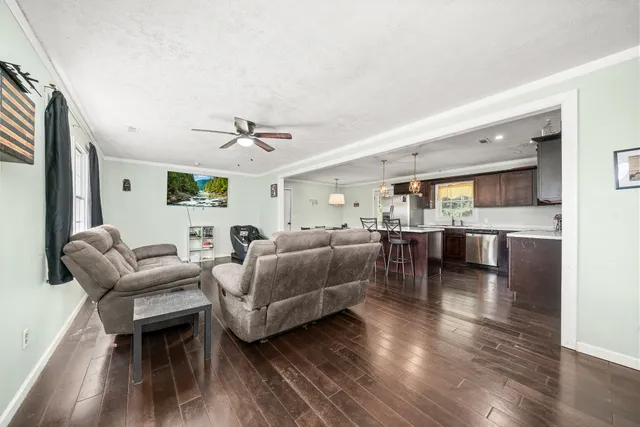 a living room with furniture and a window