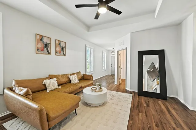 a living room with furniture and a rug