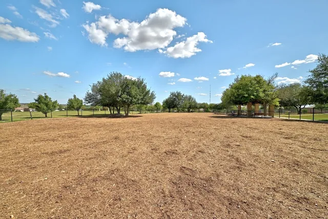 a view of a swimming pool with an outdoor space and seating area