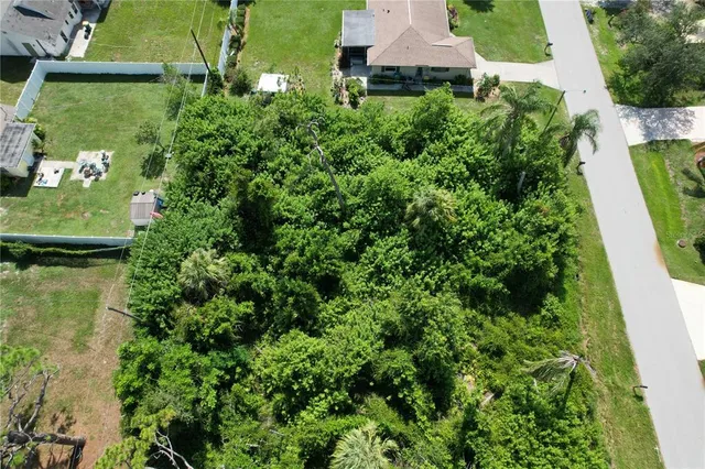 an aerial view of residential house with outdoor space