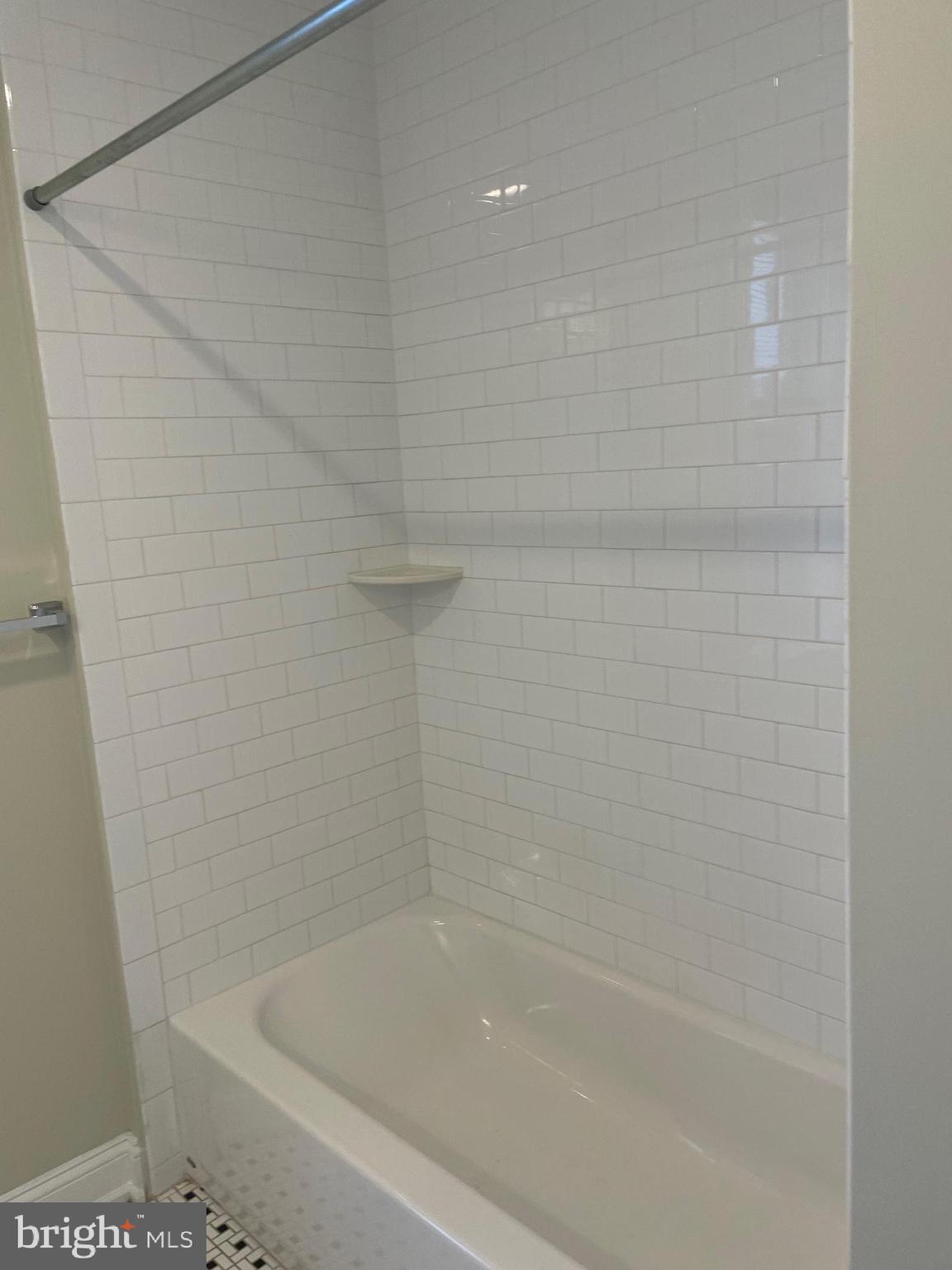 306 Cooper Street, Unit 302 Camden, NJ 08102 - Photo 12 of 21 a close up of a bathtub curtain