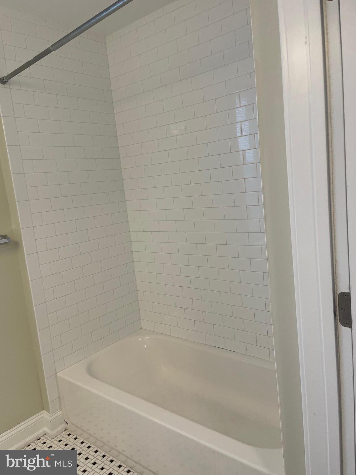 306 Cooper Street, Unit 302 Camden, NJ 08102 - Photo 14 of 21 a close up of a bathtub curtain