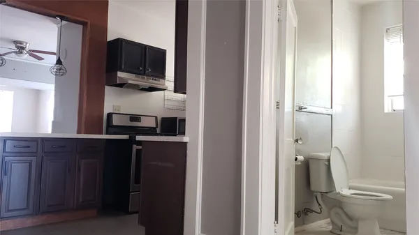 a kitchen with a refrigerator and a sink