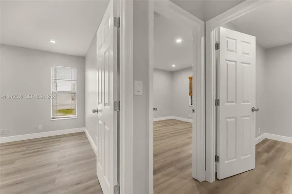 a view of a bathroom with wooden floor