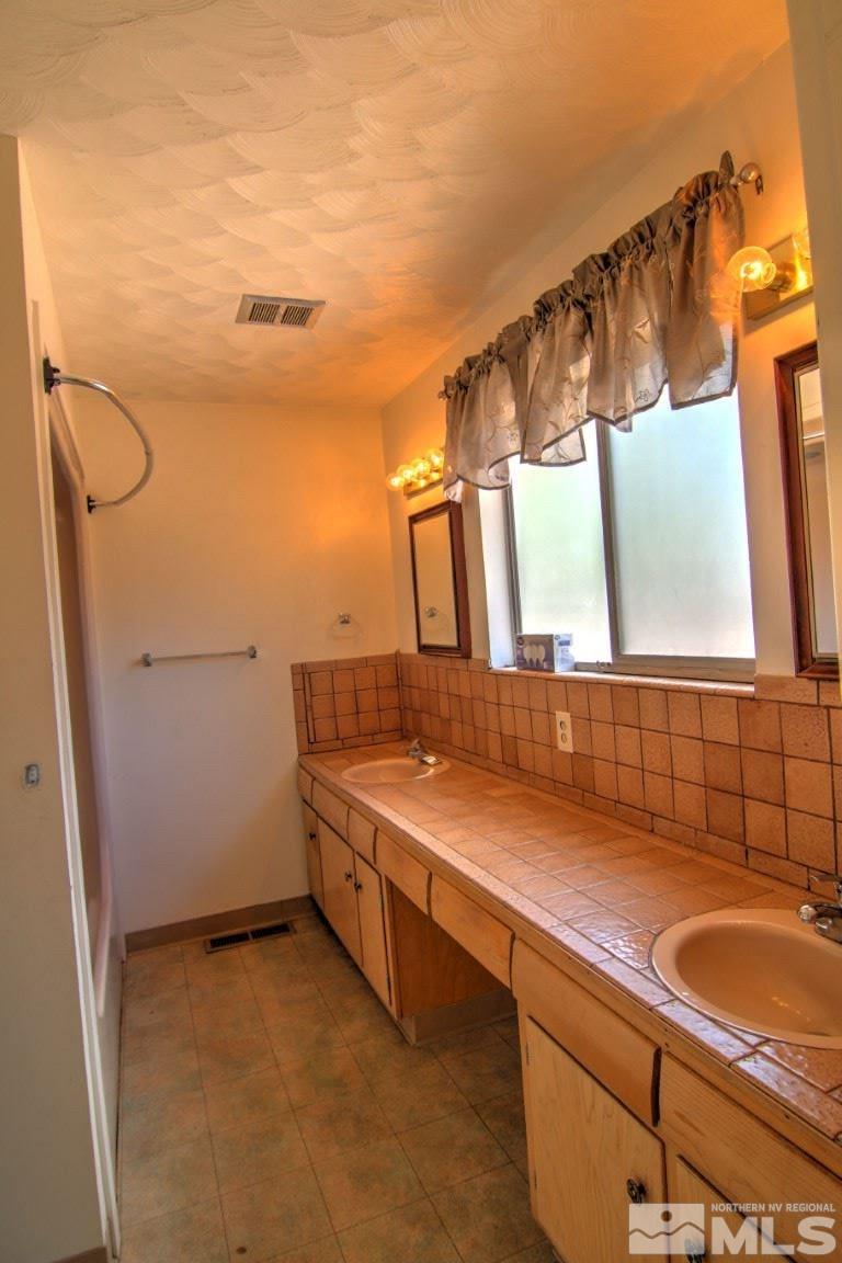 1300 Grandview Avenue Reno, NV 89503 - Photo 13 of 18 a bathroom with a sink and a mirror