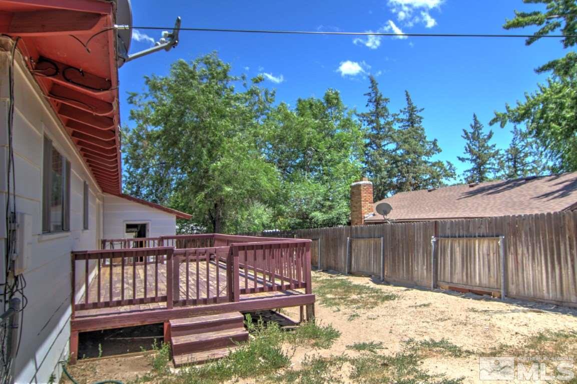 1300 Grandview Avenue Reno, NV 89503 - Photo 16 of 18 a view of deck with wooden fence and trees