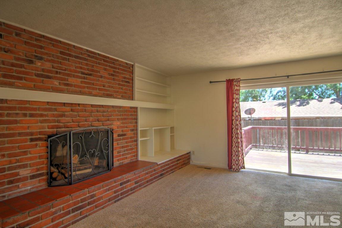 1300 Grandview Avenue Reno, NV 89503 - Photo 5 of 18 a view of empty room with fireplace and window