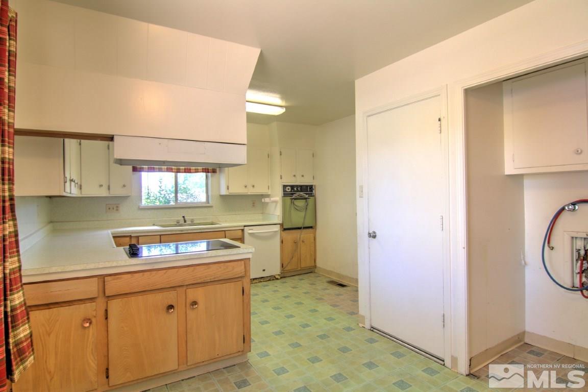 1300 Grandview Avenue Reno, NV 89503 - Photo 8 of 18 a kitchen with a refrigerator and a stove