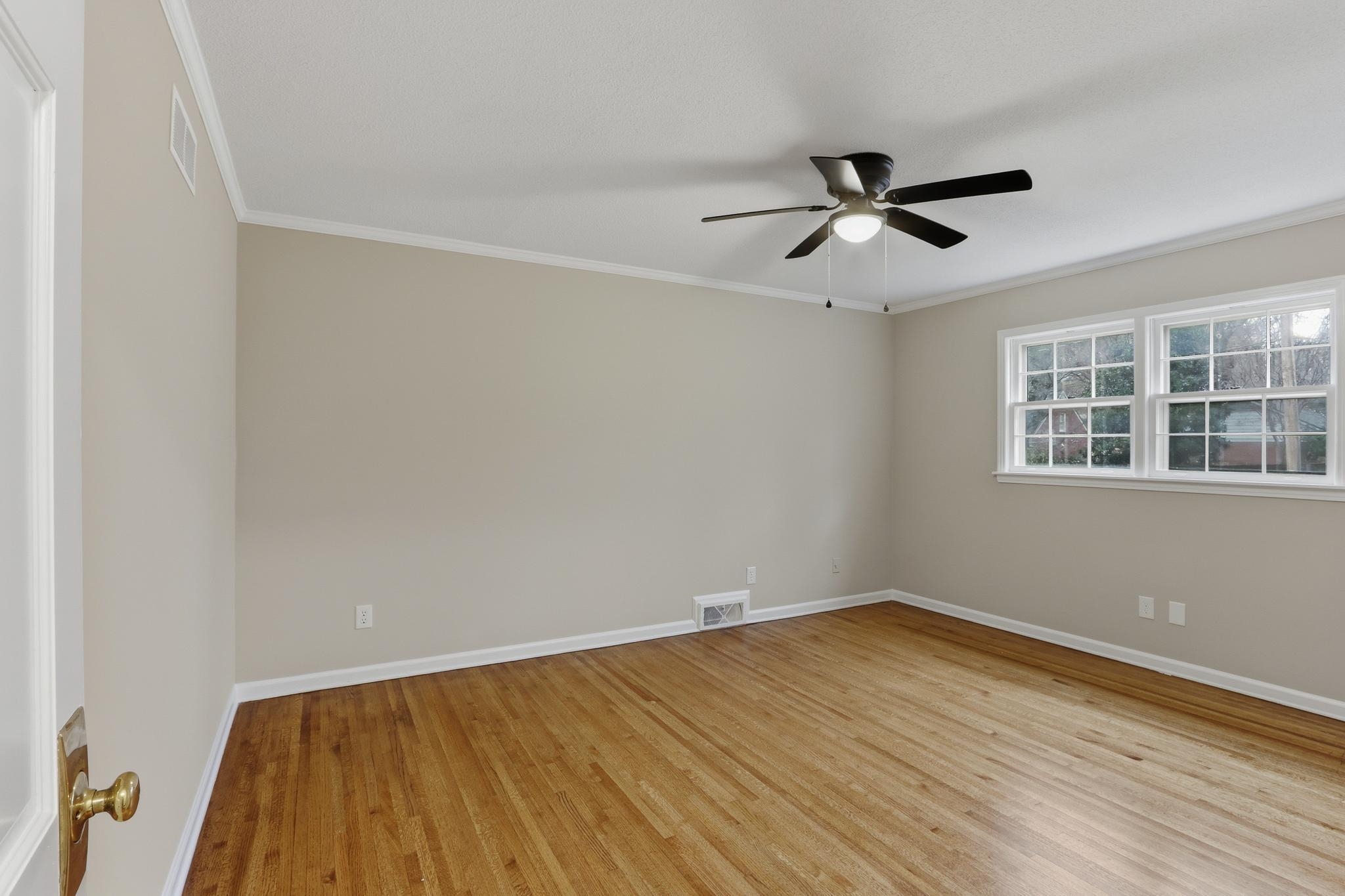 6436 Messick Road Memphis, TN 38119 - Photo 23 of 40 Unfurnished room with ornamental molding, light wood-style floors, and ceiling fan