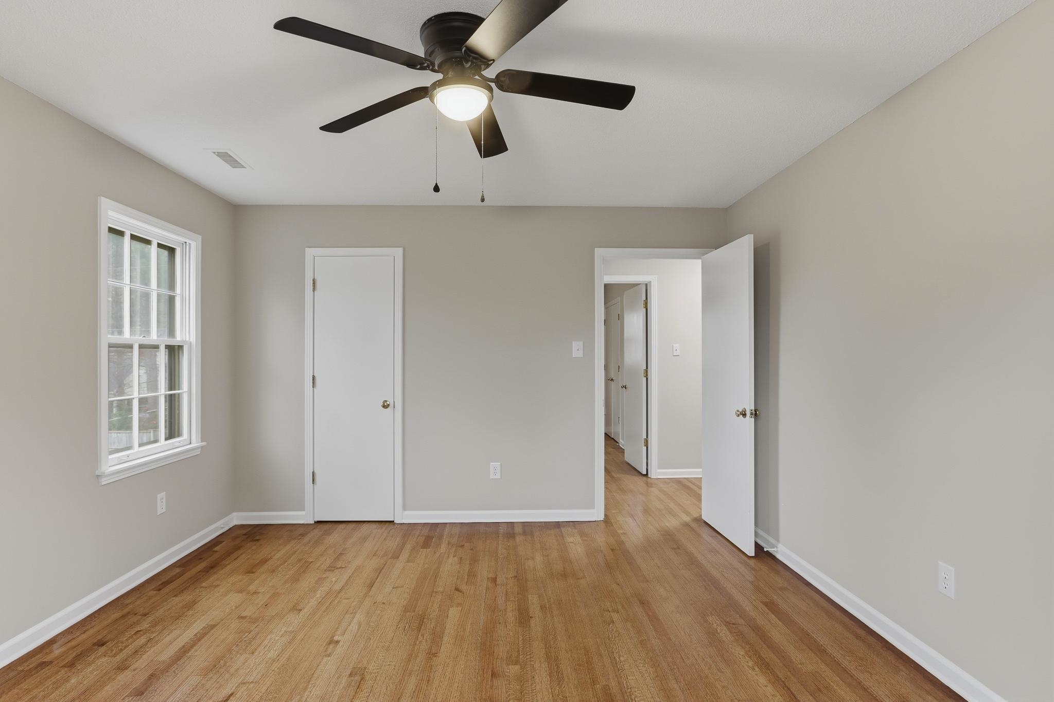6436 Messick Road Memphis, TN 38119 - Photo 29 of 40 Unfurnished bedroom with light wood-style flooring and ceiling fan