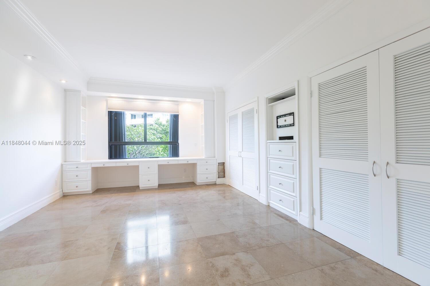251 Crandon Boulevard, Unit 243 Key Biscayne, FL 33149 - Photo 12 of 23 an empty room with windows and closet