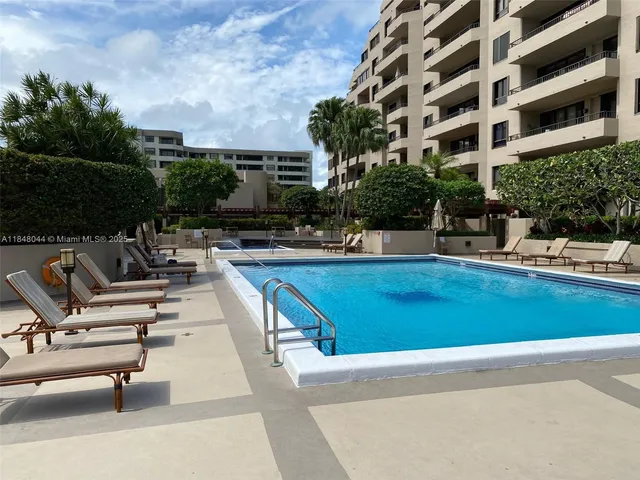 a view of a swimming pool with a lounge chair