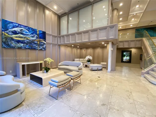 a living room with fireplace furniture and a fireplace