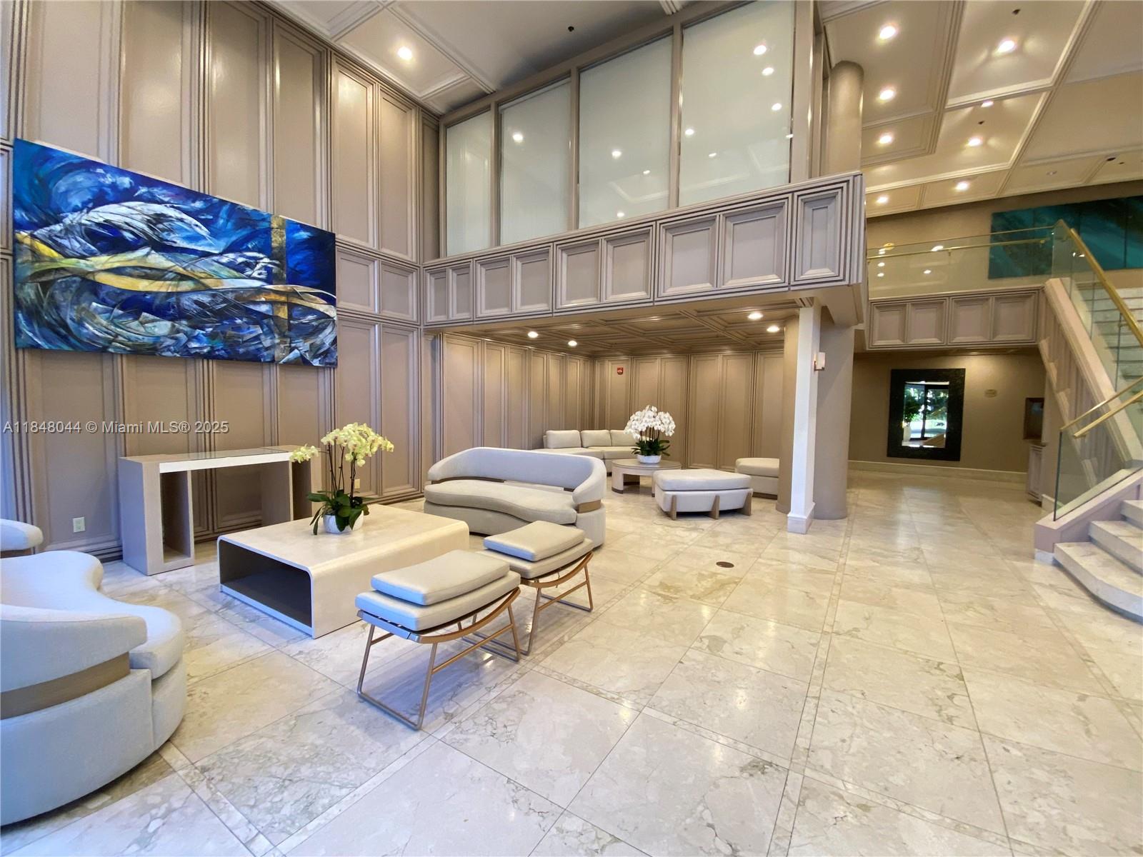 251 Crandon Boulevard, Unit 243 Key Biscayne, FL 33149 - Photo 19 of 23 a living room with fireplace furniture and a fireplace