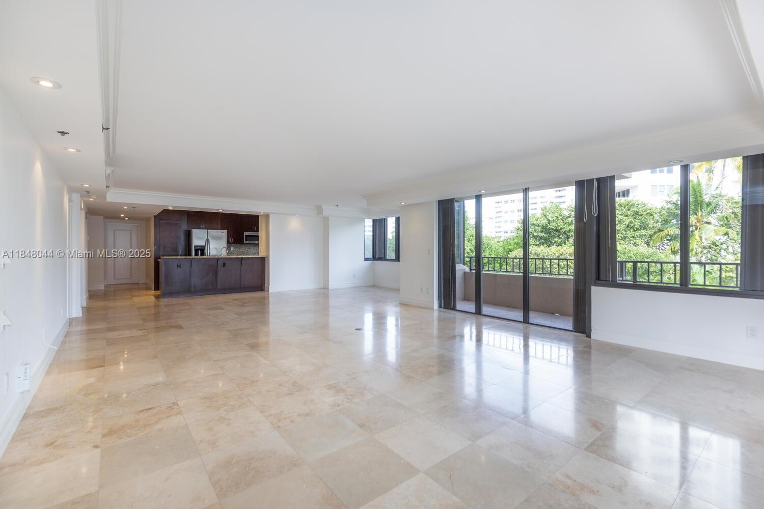251 Crandon Boulevard, Unit 243 Key Biscayne, FL 33149 - Photo 2 of 23 wooden floor in an empty room with a window