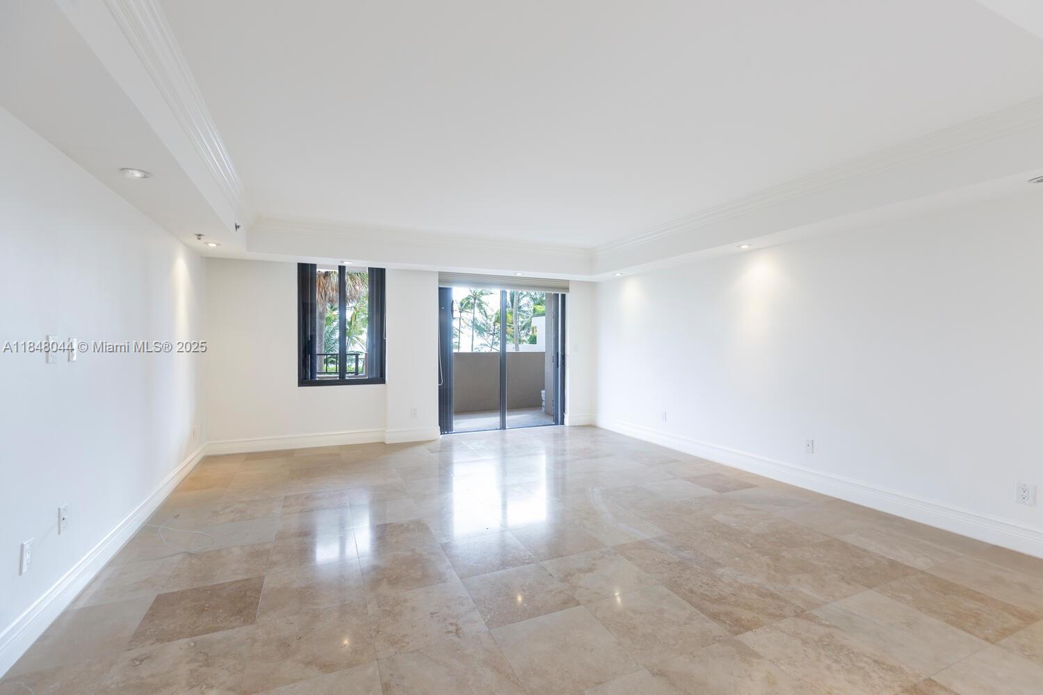 251 Crandon Boulevard, Unit 243 Key Biscayne, FL 33149 - Photo 8 of 23 a view of an empty room with window and wooden floor
