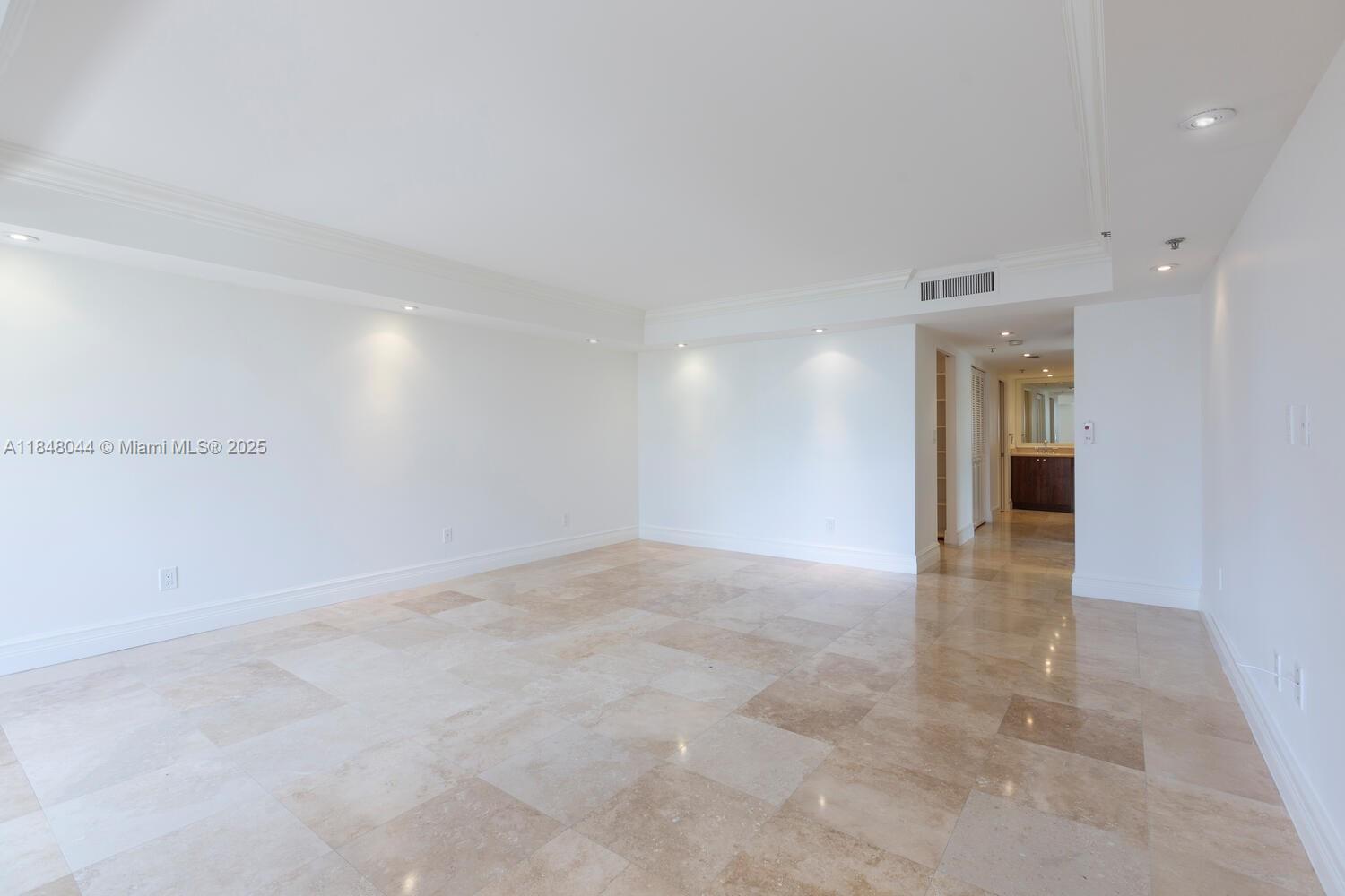 251 Crandon Boulevard, Unit 243 Key Biscayne, FL 33149 - Photo 9 of 23 an empty room with a natural light
