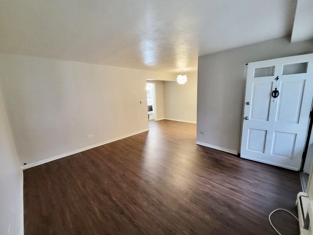 6046 West Pershing Road, Unit 4 Cicero, IL 60804 - Photo 2 of 8 a view of a livingroom with wooden floor