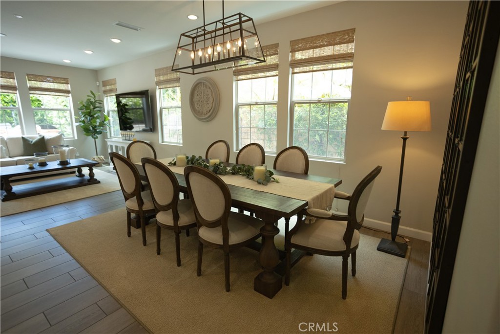 17 Honeysuckle Lake Forest, CA 92630 - Photo 11 of 36 a dining room with furniture a chandelier and wooden floor