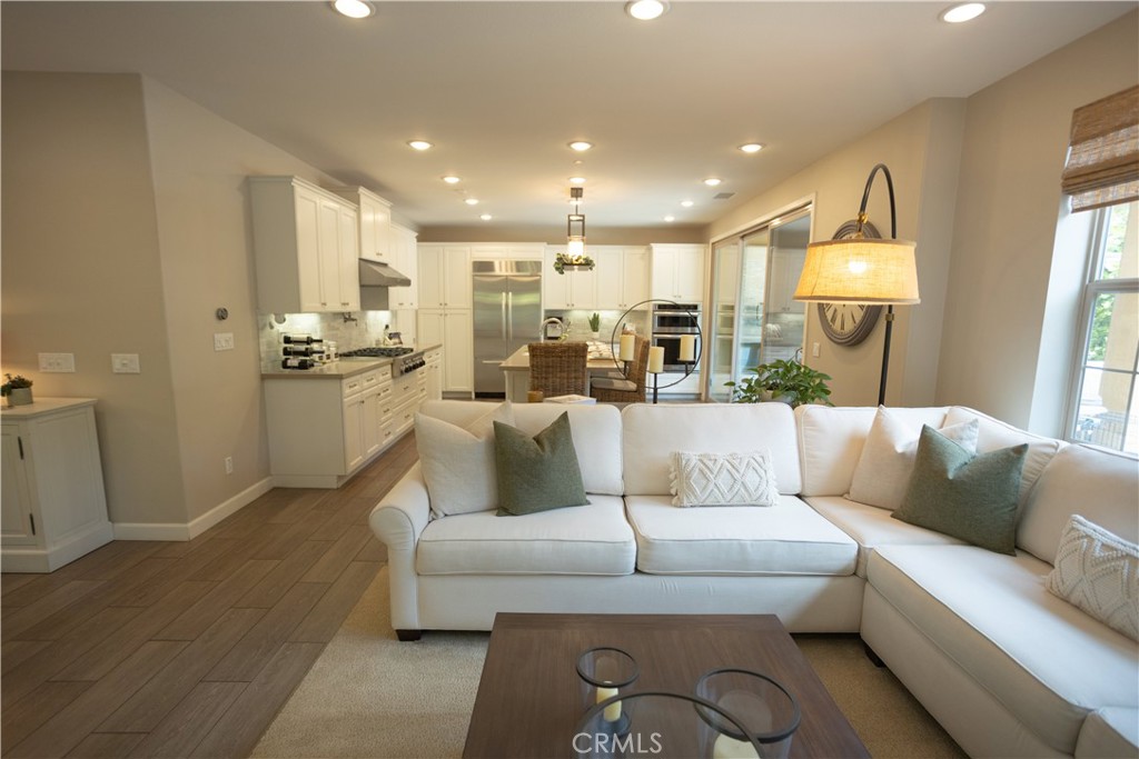 17 Honeysuckle Lake Forest, CA 92630 - Photo 15 of 36 a living room with furniture and a wooden floor