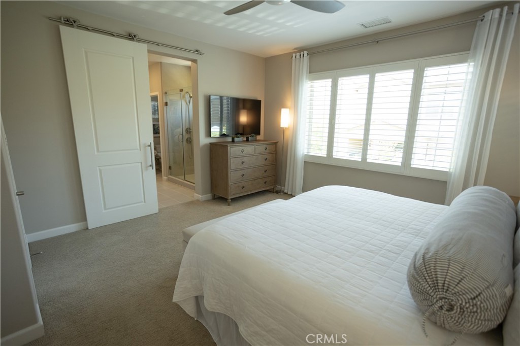 17 Honeysuckle Lake Forest, CA 92630 - Photo 16 of 36 a bedroom with a bed and a television