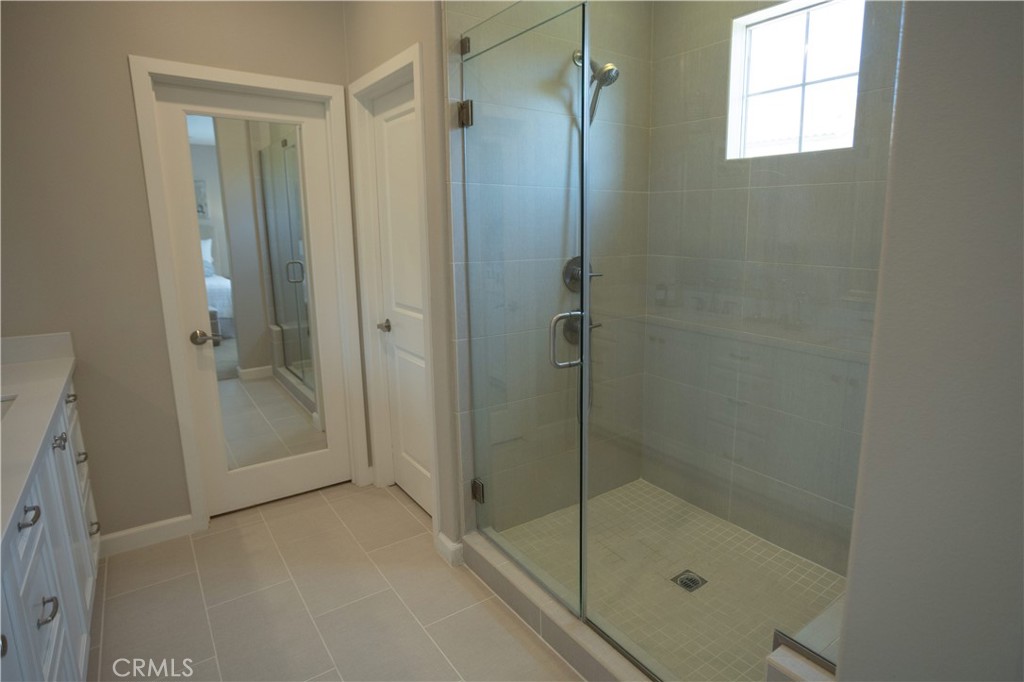17 Honeysuckle Lake Forest, CA 92630 - Photo 17 of 36 a bathroom with a glass shower door