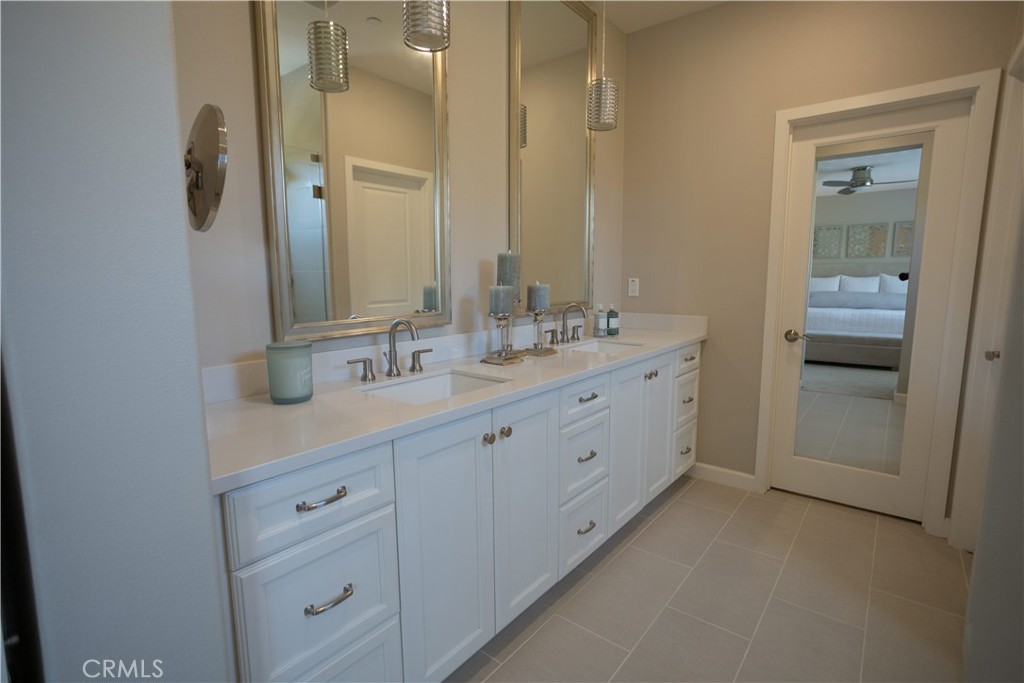 17 Honeysuckle Lake Forest, CA 92630 - Photo 21 of 36 a spacious bathroom with a double vanity sink a mirror and a shower