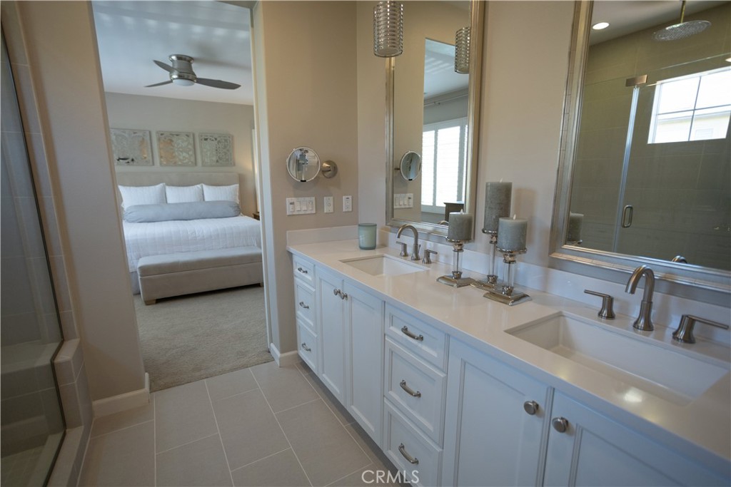 17 Honeysuckle Lake Forest, CA 92630 - Photo 23 of 36 a en suite bathroom with double sink and a mirror