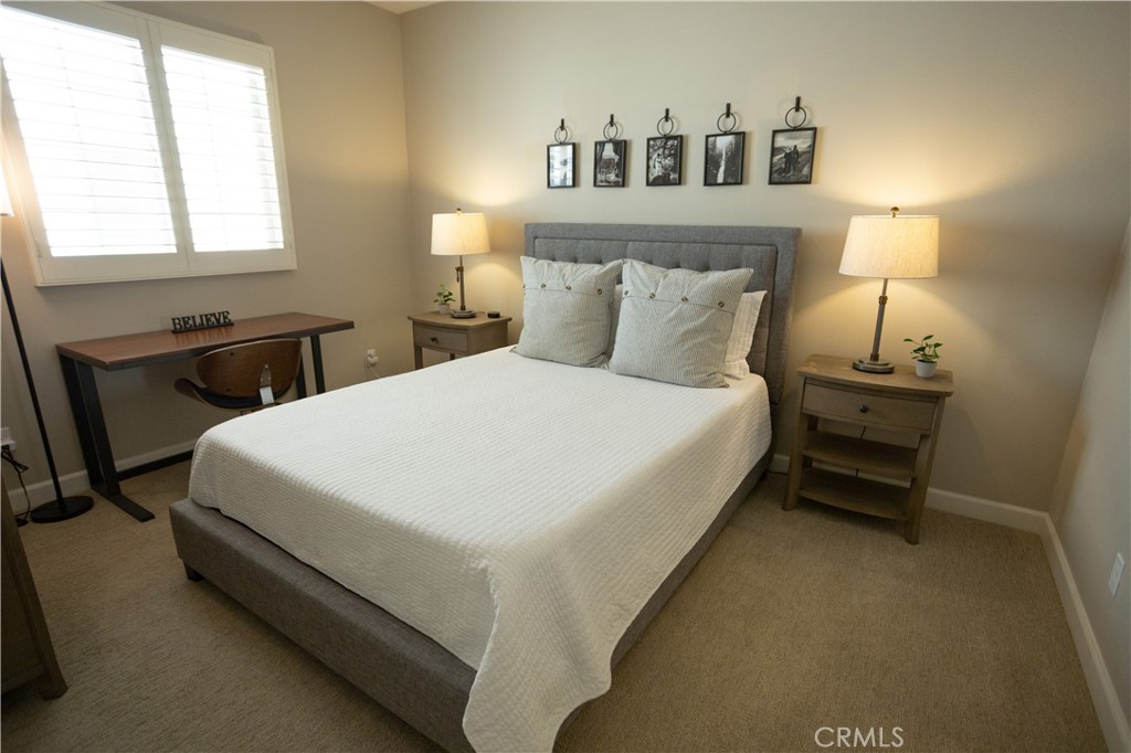 17 Honeysuckle Lake Forest, CA 92630 - Photo 24 of 36 a large bed sitting in a bedroom next to a window