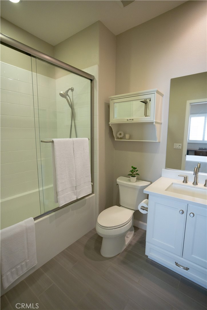 17 Honeysuckle Lake Forest, CA 92630 - Photo 26 of 36 a bathroom with a toilet a sink and mirror