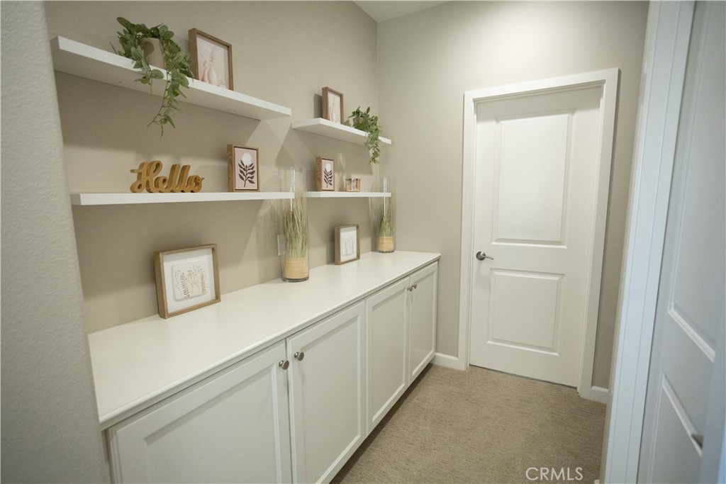 17 Honeysuckle Lake Forest, CA 92630 - Photo 30 of 36 a hallway with cabinets