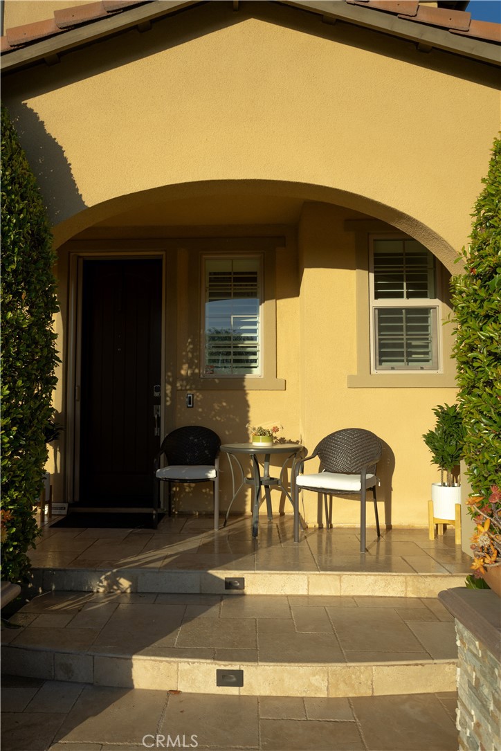 17 Honeysuckle Lake Forest, CA 92630 - Photo 5 of 36 a view of a patio with table and chairs and potted plants