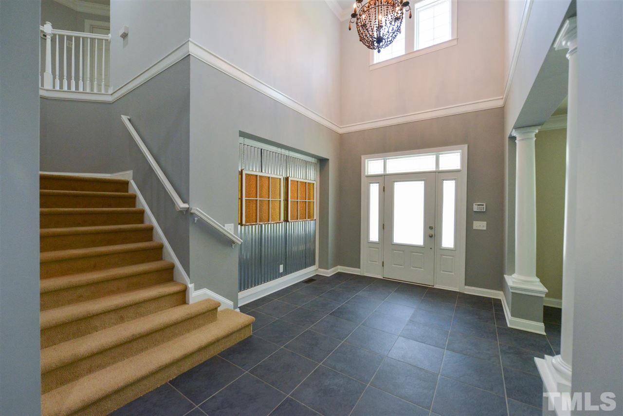 13015 Saxon Way Raleigh, NC 27613 - Photo 4 of 30 a view of an entryway with staircase