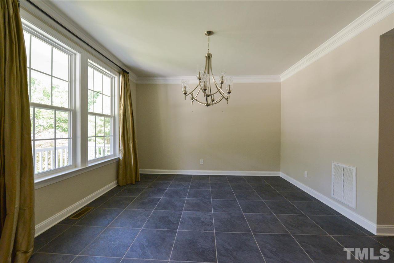 13015 Saxon Way Raleigh, NC 27613 - Photo 5 of 30 a view of an empty room with a window