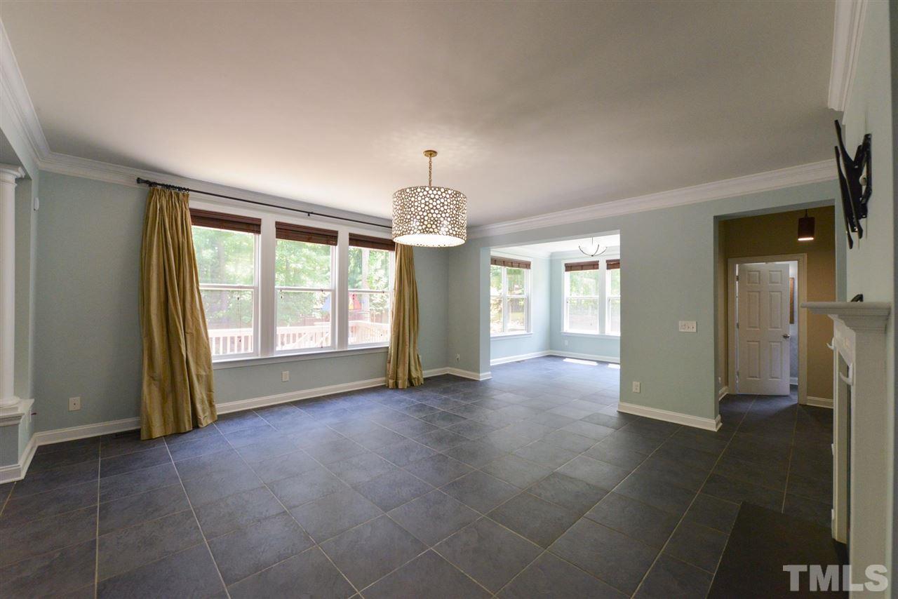 13015 Saxon Way Raleigh, NC 27613 - Photo 9 of 30 a view of livingroom with hardwood floor and a ceiling fan