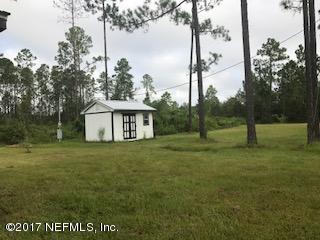 155 Pine Acres Road St. George, GA 31562 - Photo 5 of 8 a view of a house with a yard