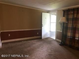 155 Pine Acres Road St. George, GA 31562 - Photo 7 of 8 an empty room with windows