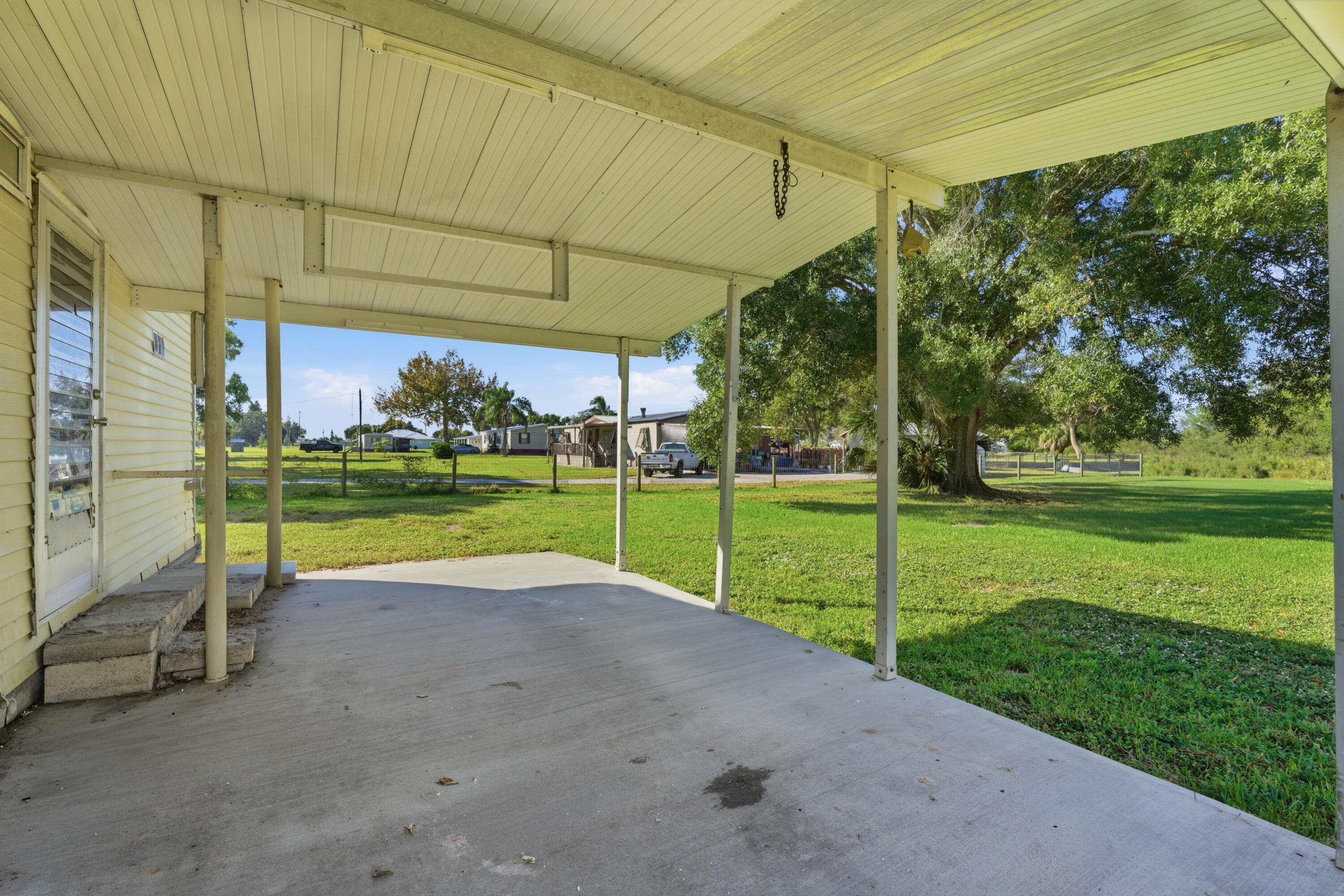3765 Southwest 13th Terrace Okeechobee, FL 34974 - Photo 6 of 10 a view of a park with swings