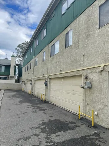 a small garden on the side of a building